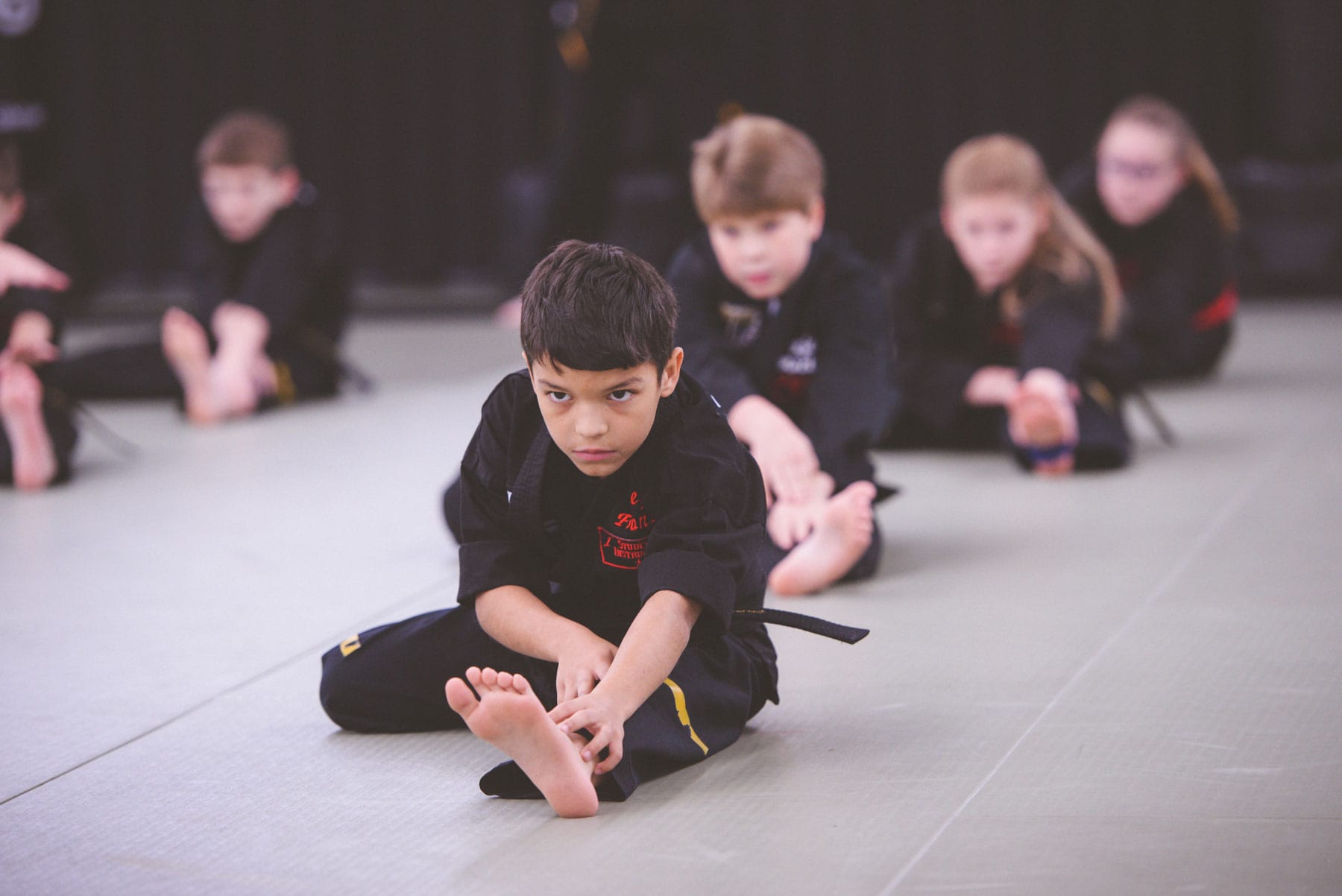 Martial artss kids stretching in Springboro